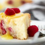 a picture of raspberry ricotta cake topped with lemon curd glaze