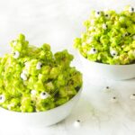 This quick and easy 6 ingredient green slime popcorn with candy eyeballs is a fun spooky Halloween treat! Perfect for kids or adult parties!