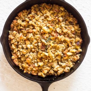 Simple Cornbread stuffing/dressing comes together easily. Caramelized onions, sweet corn muffins and fresh sage. This Cornbread stuffing is moist with a slightly craggy soft top. Simply delicious!