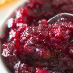 Maple Cranberry Sauce with fresh cranberries are sweetened with pure maple syrup, orange juice, white sugar with a hint of vanilla, and a pinch of salt and pepper. Simmering the cranberries for 10-15 minutes result in a nice, thick, deep dark and flavorful cranberry sauce.