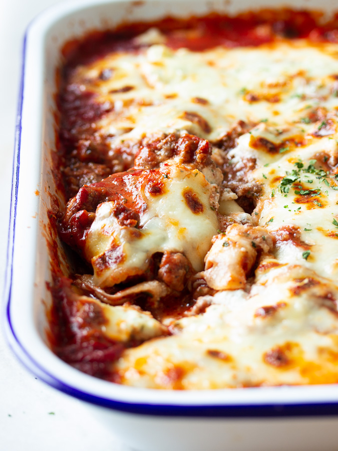 A plate of ravioli lasagna bake with meat sauce 