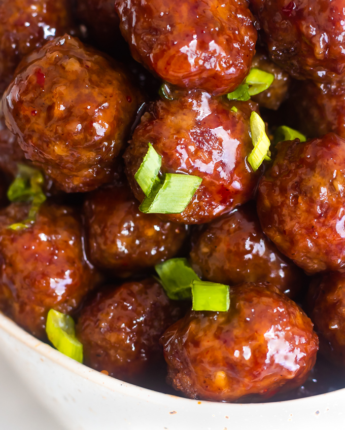 A closeup of a bowl of jelly meatballs