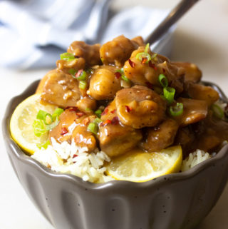 Caramel chicken in a bowl over rice