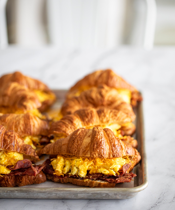 A photo of a bacon egg and cheese croissant