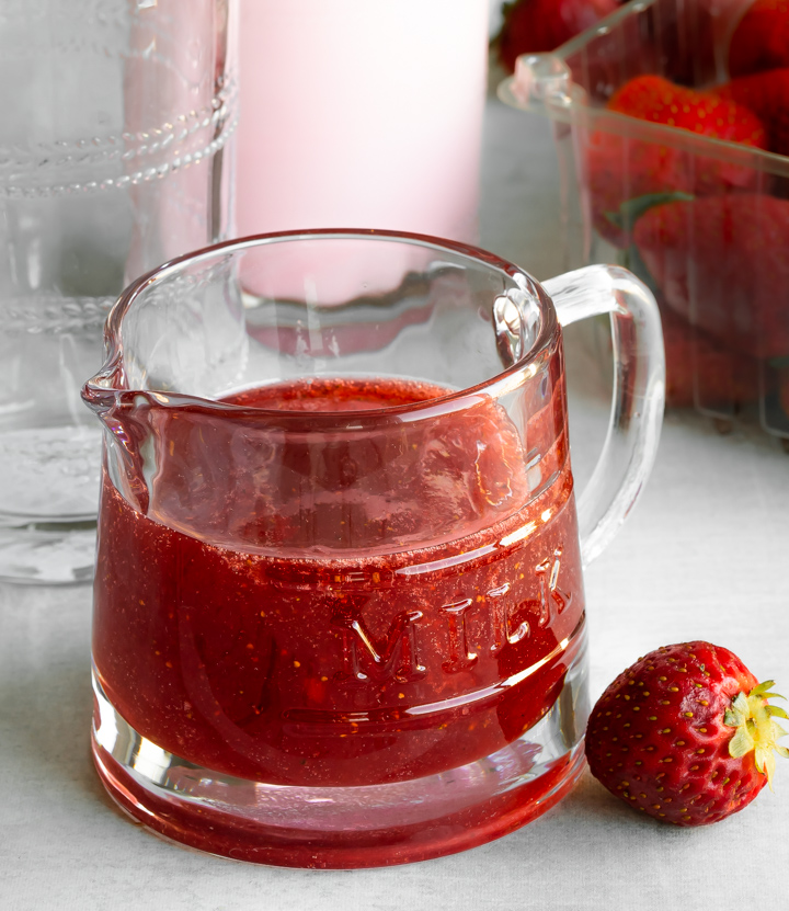 homemade strawberry syrup in a glass