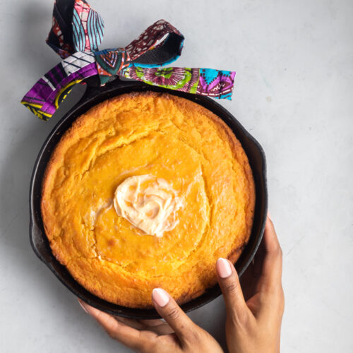 a picture of sweet potato cornbread in a cast iron skillet