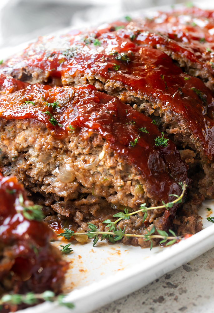 A photo of Ritz Cracker meatloaf on a plate with sweet and spicy glaze 
