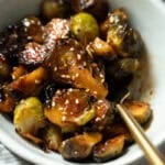 A bowl of sweet and spicy sweet chili sauce brussels sprouts