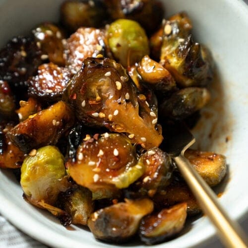 A bowl of sweet and spicy sweet chili sauce brussels sprouts