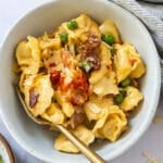 Bowl of creamy tortellini carbonara with bacon and parmesan
